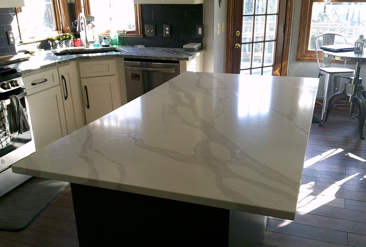 TowerSurfaces's tweet image. Using a different color/material for your island from your counter top can create a beautiful contrast!