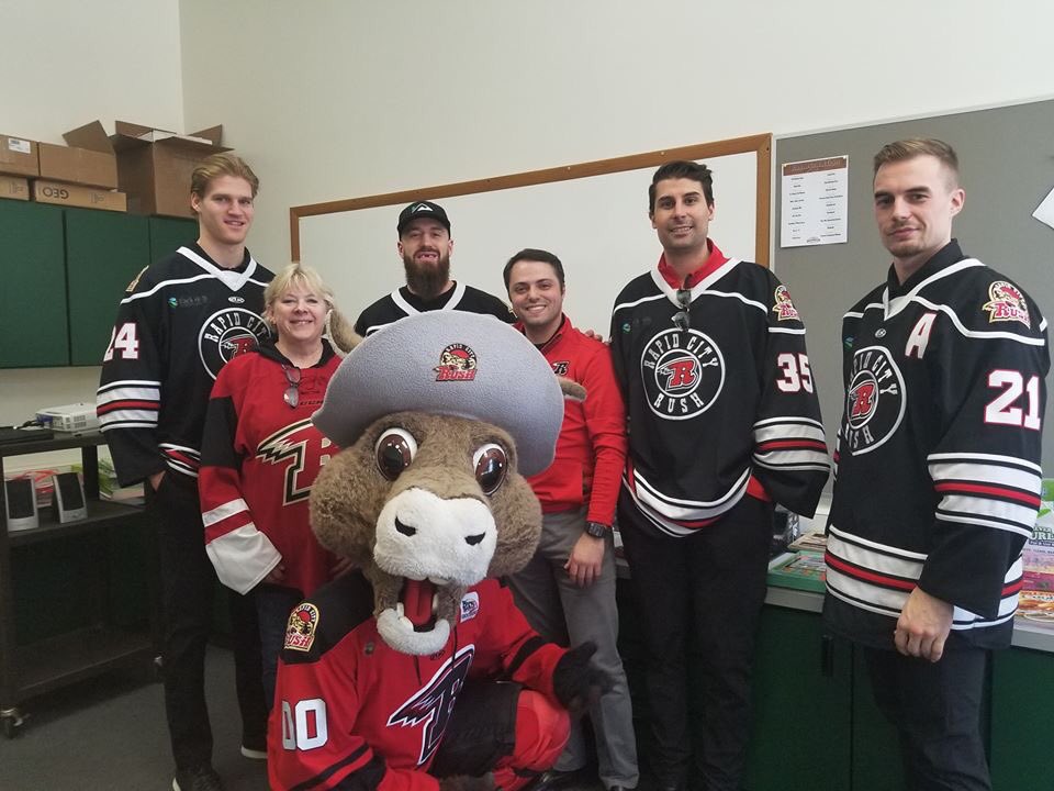 NuggetTheMascot's tweet photo. Fantastic afternoon at the Lead/Deadwood Elementary school as some of the @RapidCityRush players came to read to the kids. 
They also had a pep rally to gear up for Wednesday mornings game and the Rush to Read program.
It was all wonderful.
#Reading #Rush2Read #PepRally #NewRush https://t.co/ck3aI5BlcK