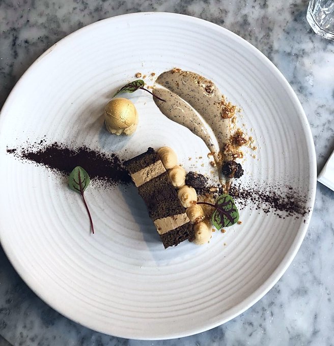 "A Night at the Opera" - our sensational Valentine's Day dessert. A rich coffee terrine, gold-leafed truffle, creamy salted caramel ice-cream &amp; spiced nougatine coffee anglaise. A dessert plate sprinkled with magic.