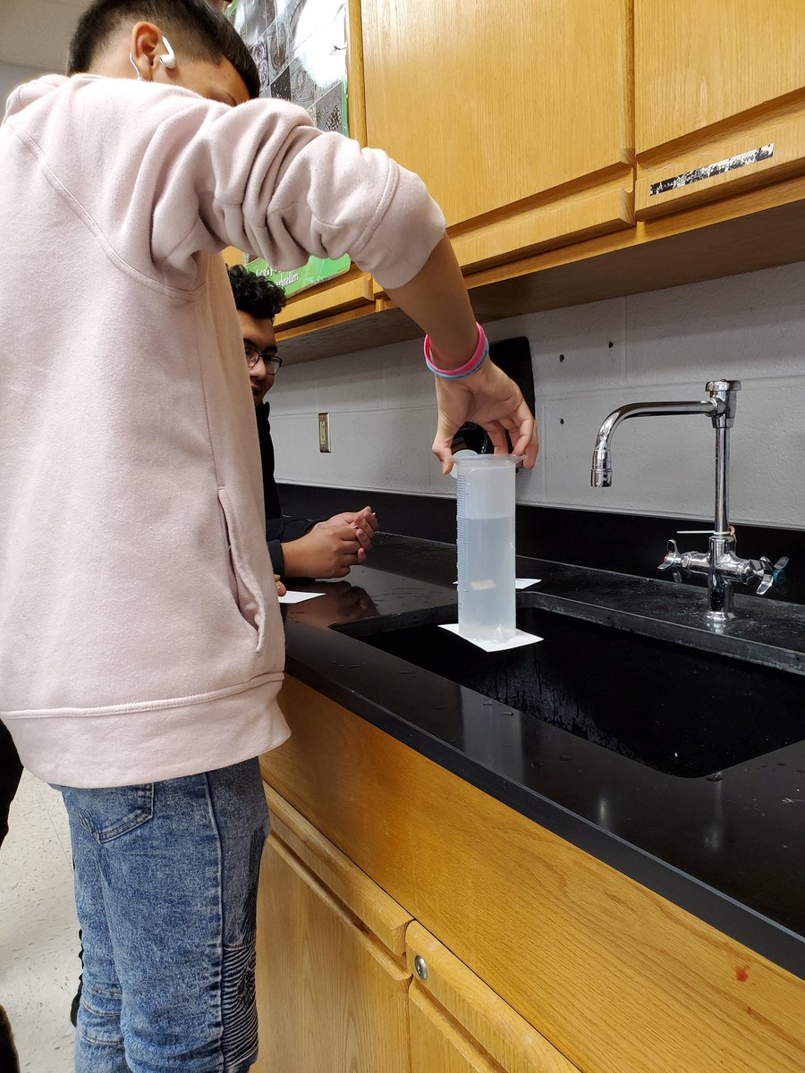 RussoScience's tweet photo. Magic?? Nope, science! We're learning about air pressure today, and students did a quick experiment to see if they could get an index card to stick to the bottom of a graduated cylinder after filling it with water and flipping it upside down. https://t.co/56z5ghoGYJ