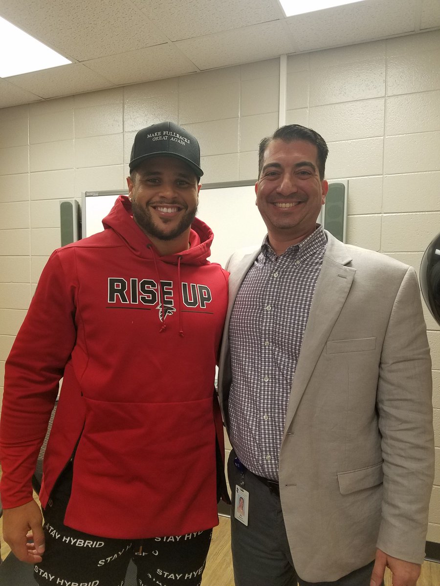Prin_Santoro's tweet photo. Whatever you did for lunch today is nowhere close to how cool ours was at @WoodstockMS . @K_SMITH31 surprised Audric and his family for lunch today. Keith is as classy as them come, and he gave a great young man and his family a wonderful memory. @AtlantaFalcons https://t.co/OhLKn6mqRD