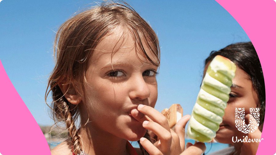 Young girl eating a Twister ice cream on a sunny day