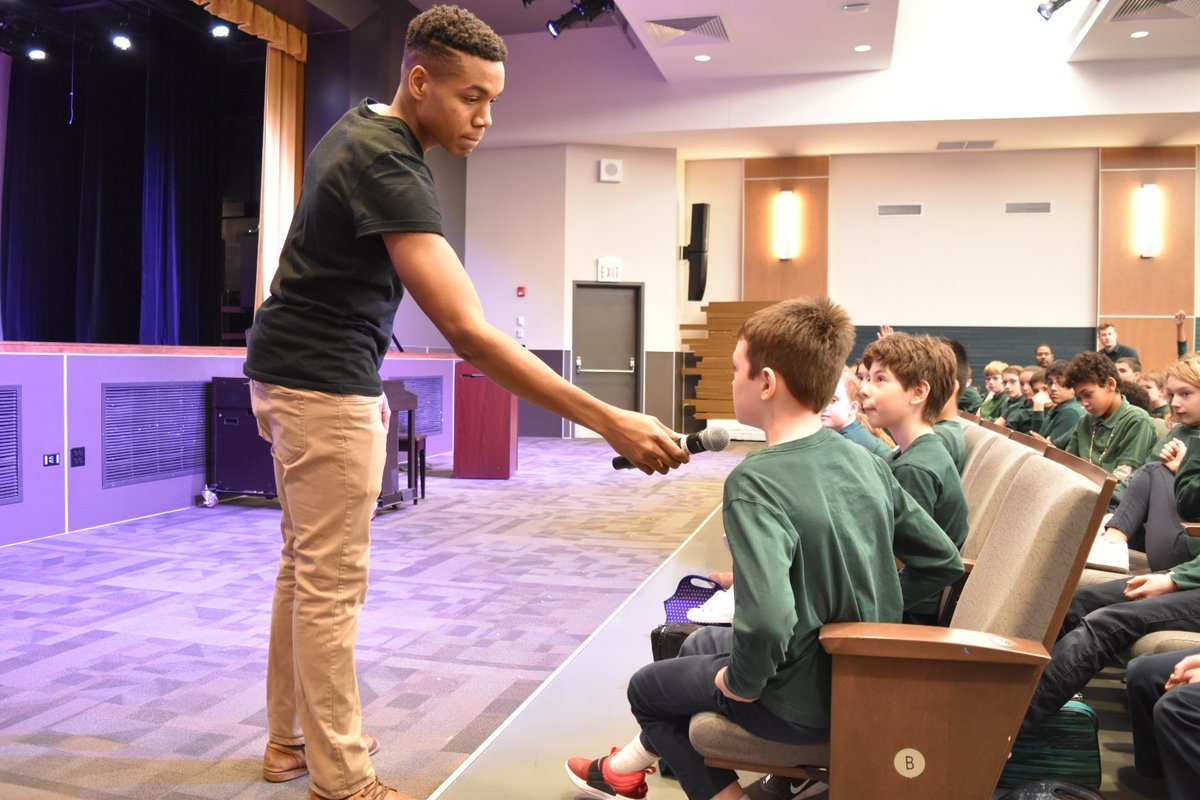 FXWChicago's tweet photo. As part of their poetry unit, the 5th Graders had a guest speaker last week: FXW alumnus Zion Mallette '14! Zion visited the 5th Grade to discuss Spoken Word poetry, answer student questions, and perform a Spoken Word piece of his own. #FXWExperience #FXWAlumni https://t.co/yYVXgYudUN