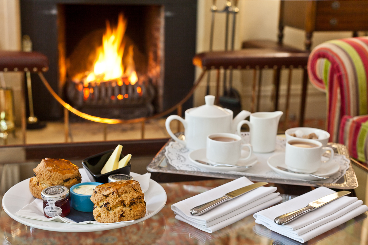BridgeLakes's tweet photo. Warming up with a cream tea in front of a roaring fire. There are worst ways to spend a Wednesday afternoon. Are you jam or cream first? #creamfirst #creamtea #buttermere #lakedistrict🥰 https://t.co/ga9AIR1I3Z