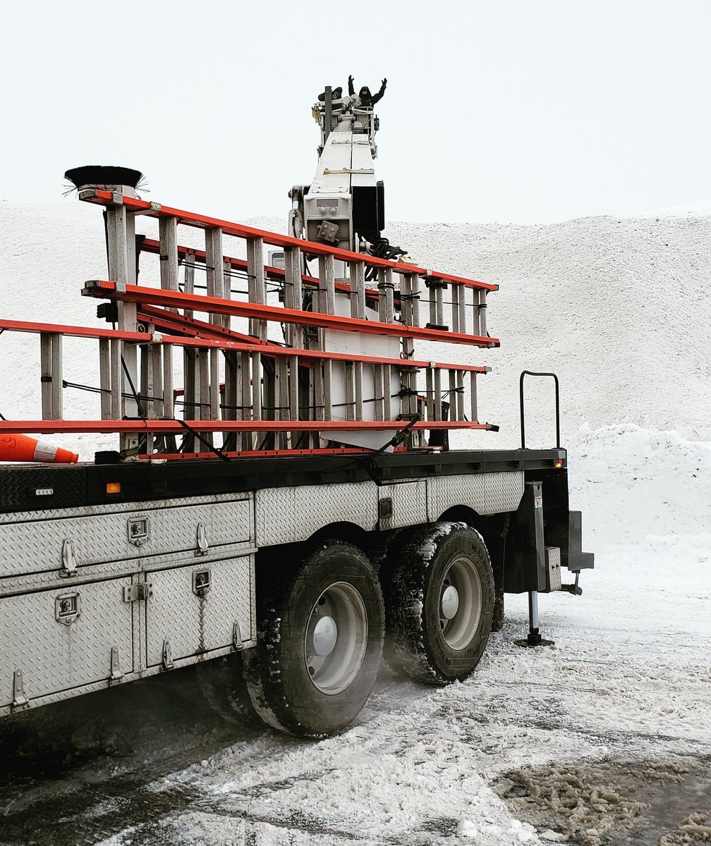Installations during the winter months come with a unique set of challenges - here's the 85ft crane conquering a massive snowbank! #LED #lighting #efficiency #lowmaintenance #realestate #parkinglot #commerciallighting #shoppingmalls