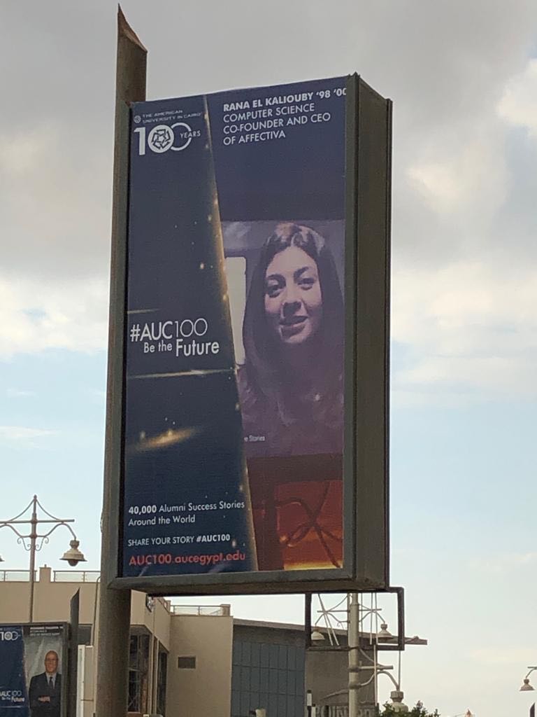 Affectiva's tweet photo. The Cairo team was so excited to take photos of the billboards and posters featuring CEO and co-founder @kaliouby all around the city as @AUC celebrates its centennial. Alumna and Trustree, Rana will speak on Feb 17 as part of the #AUC100 celebration on humanizing #technology. https://t.co/hJCDQBLWVg