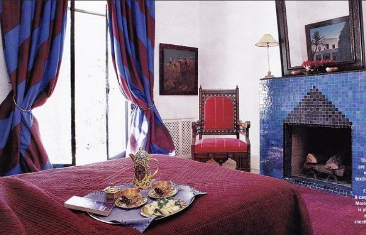 Once heavily draped and opulent, the new guest rooms, such as this one, were outfitted with bright, simple cottons. Here, cotton rideaux in large-scale carnival stripes dresses a window. Ultramarine blue and red-violet vibrate against the crisp white plaster walls.