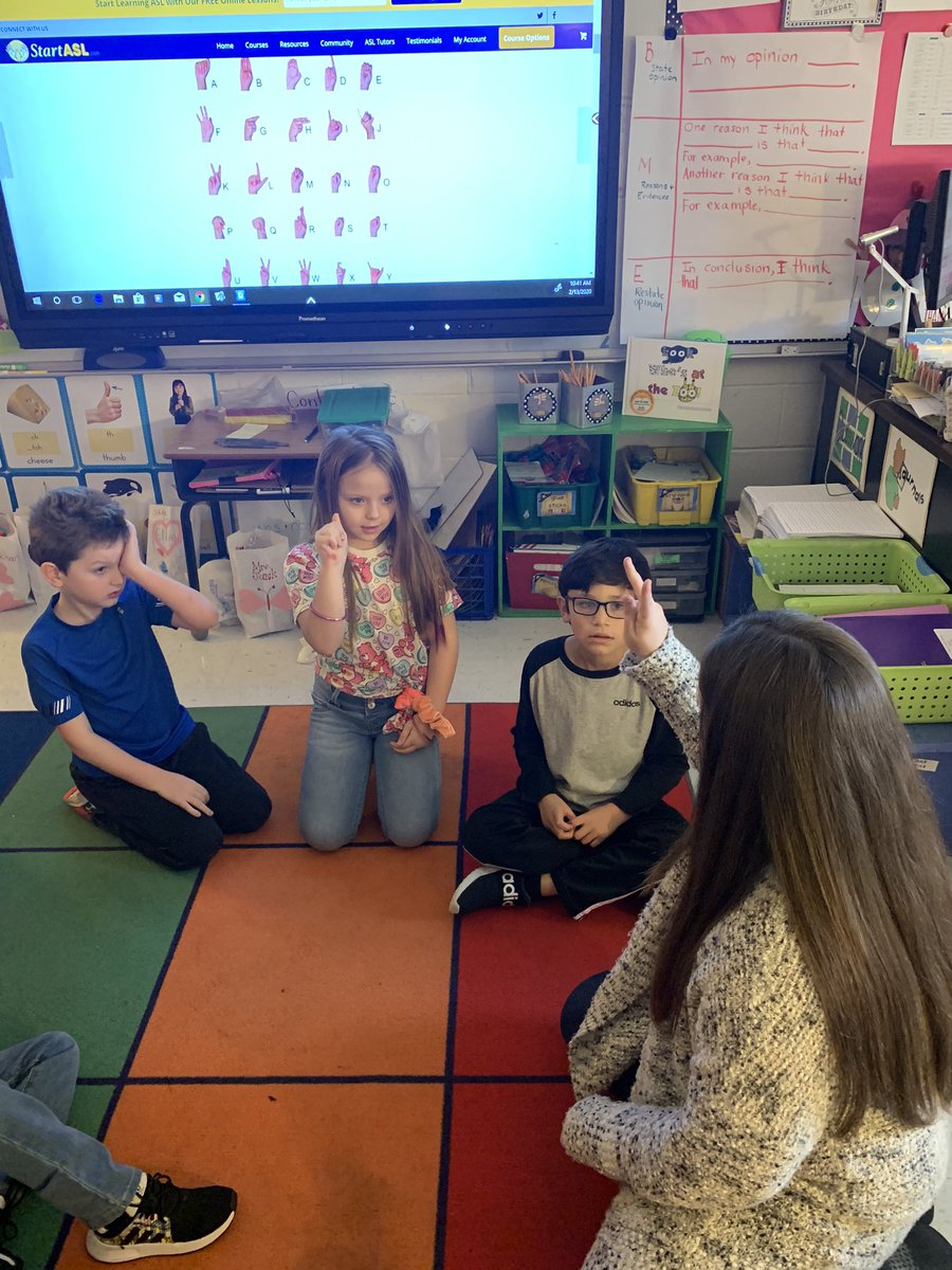 After reading about a gorilla who learned sign language, these kiddos are learning to sign their names!