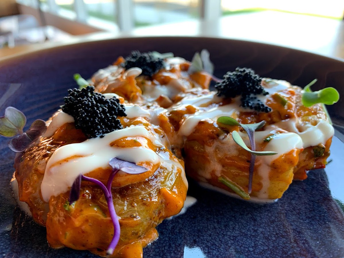 To share or not to share? We'll let you decide. [Papas Bravas: Smashed Yukon Gold Potatoes, Adobo, Crème Fraiche, Caviar]
