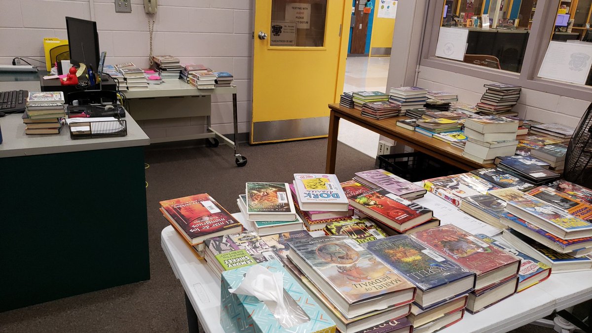 My student: "You look like a librarian that is crazy about books!"
Me: "Bless you my child.  You have given me the courage to post this picture!
But seriously, this is the chaos of my office during our Book Series Challenge that we kicked off during Literacy Week!