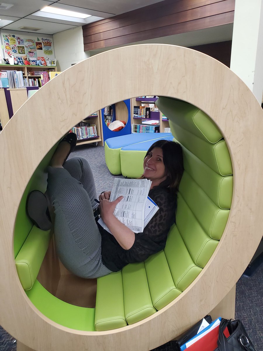 Sdaniel31's tweet photo. Our Principal Mrs. Wilson trying out the new furniture in the library. Super cute and comfy. https://t.co/rSDTCJxcFH