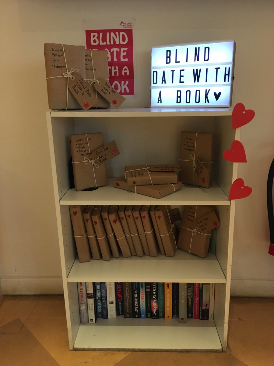 MacbobVic's tweet photo. How amazing is our Duty Manager Kelda, she’s revamped our bookcase for Valentine’s Day!  @Macrobert #BlindDateWithABook https://t.co/PItWwzlBsz