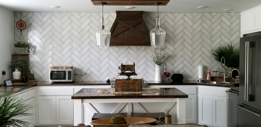 Is it time to give your home an update? Come check out our showroom for the latest trends in home design, like this modern farmhouse kitchen backsplash. #homeimprovement #kitchen #backsplash #diy #tile #flooring #brick #homedesign #southeastlouisiana