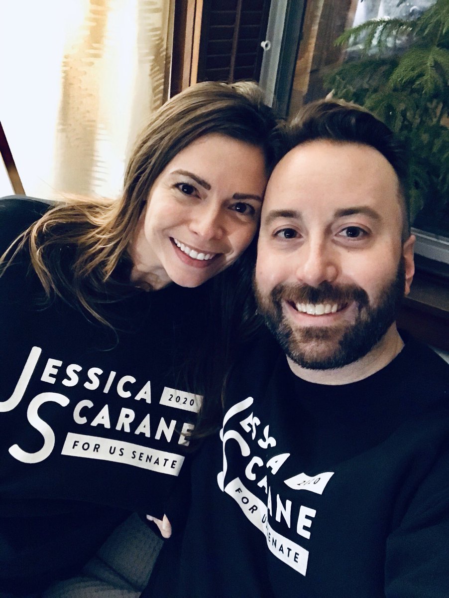 Selfie of Jess and Bill wearing campaign sweatshirts