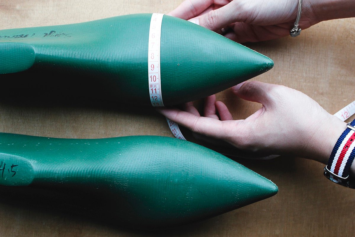 otabo's tweet image. Measuring the ball girth on sample lasts before moving on to create the upper pattern. 📏#manufacturedbyotabo