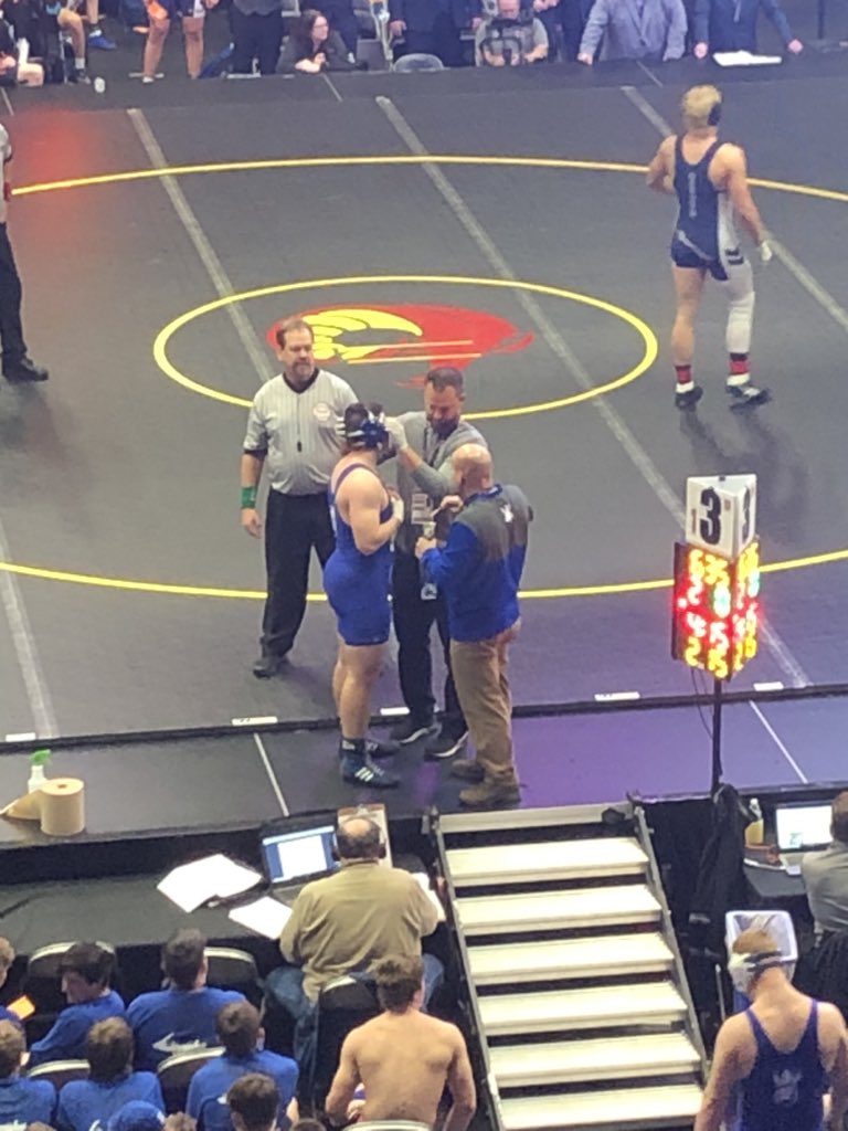 ManuszakEdward's tweet photo. This is what makes a Championship  Head Coach and Program. During our @mhsaa Division 3 championship match he personally attends to one of our wrestlers and cares for him! He cares about every person associated with this program! #rowlikevikings #Quest4XII https://t.co/emfIG2OiGI
