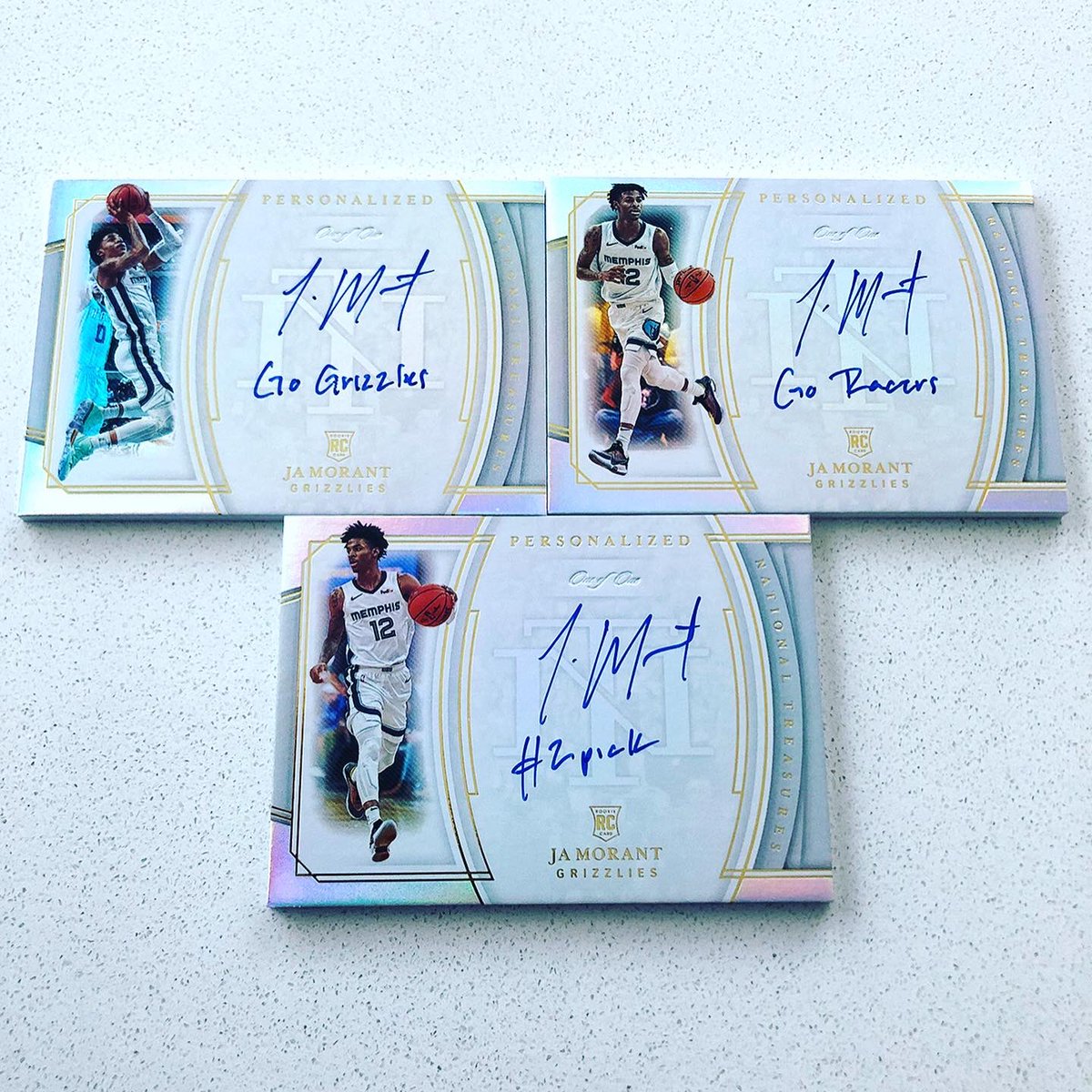 PaniniAmerica's tweet photo. We caught up with @memgrizz rookie sensation @JaMorant today for a key @PaniniAmerica and @PaniniAuthentic signing session. Here are just some of the fruits of that labor . . . #WhoDoYouCollect 

#GrindCity | #NBA https://t.co/BkUUt4Kdga