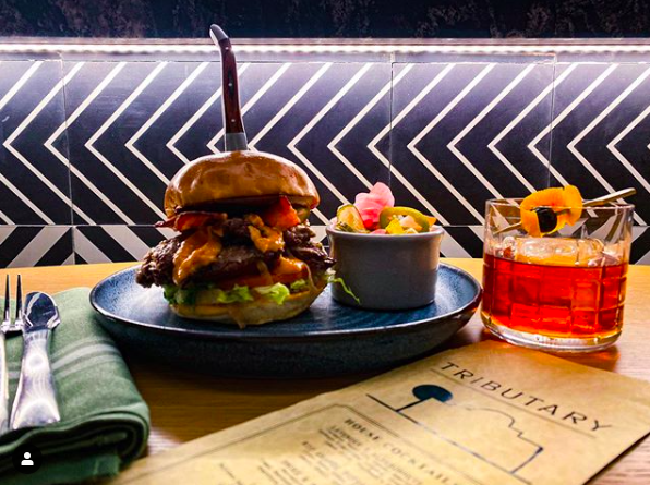 SAcurrent's tweet photo. Stop into Tributary at the San Antonio Marriott Rivercenter for their Tributary Burgerโฆ $8 only during SA Burger Week!
#satxburgerweek #sanantonioburgerweek #burgerweek2020 https://t.co/0PYKQSgEZ9