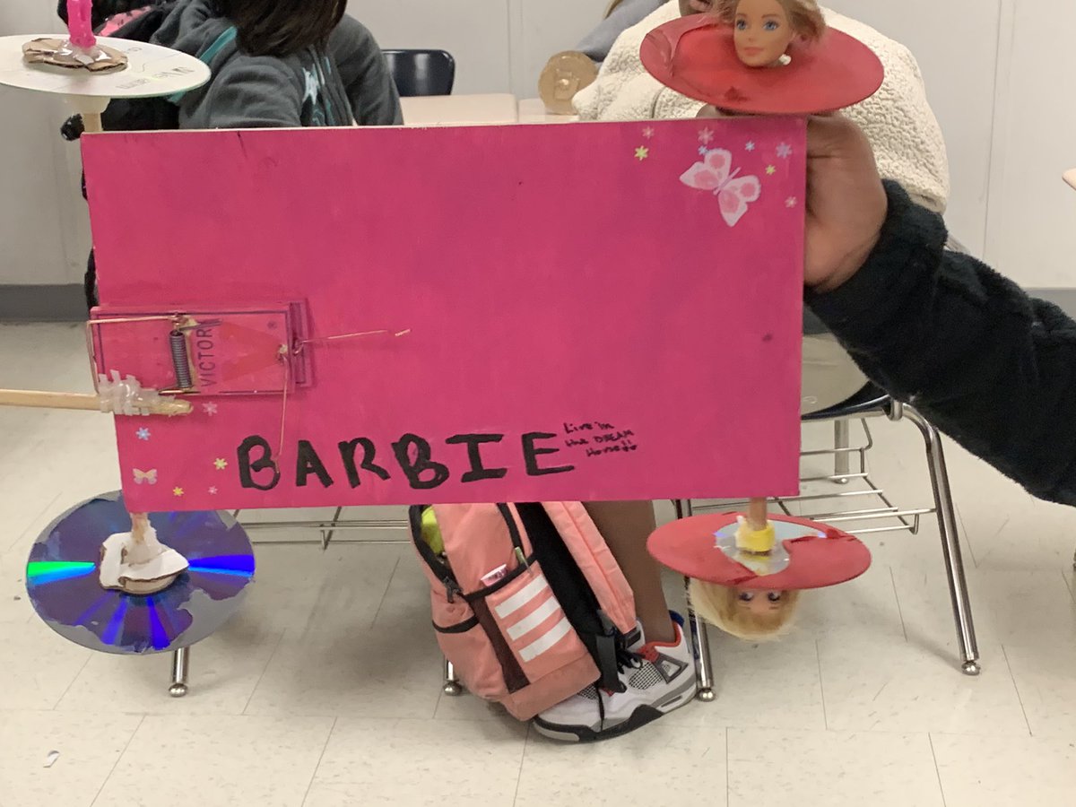 Khyde3428's tweet photo. This mousetrap car design called for a new category of “creepy yet creative.....used Barbie heads to keep wheels on the car 😳 @GoBucsSJHS #southsideALLin #HydeAndTeach #6thgradeinprogress #CreepyButCreative #MousetrapCars #NewtonsLaws https://t.co/kX2t1UC32h
