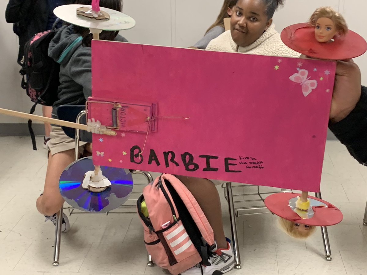 Khyde3428's tweet photo. This mousetrap car design called for a new category of “creepy yet creative.....used Barbie heads to keep wheels on the car 😳 @GoBucsSJHS #southsideALLin #HydeAndTeach #6thgradeinprogress #CreepyButCreative #MousetrapCars #NewtonsLaws https://t.co/kX2t1UC32h