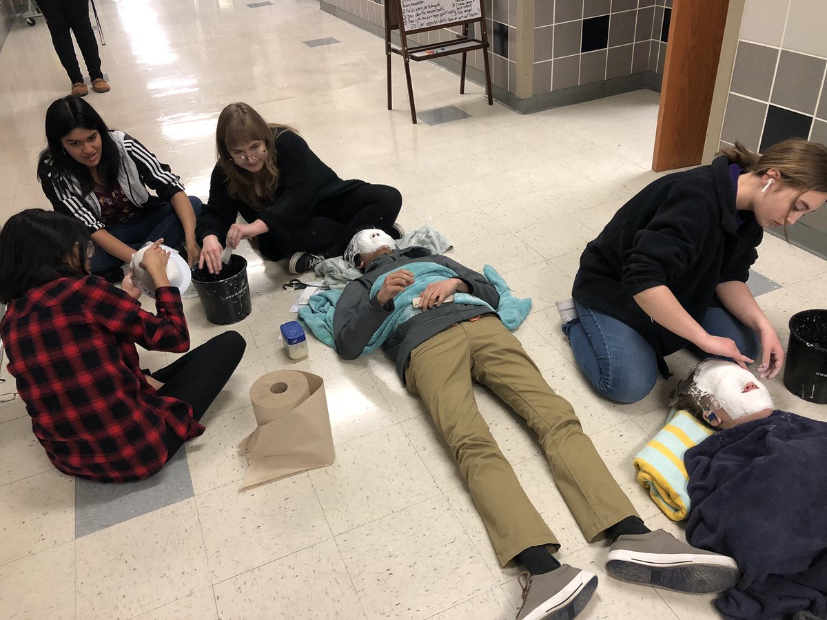 Ms. Greenwood’s class making molds of their faces.  Or turning each other into mummies.  Cool either way!!  Haha