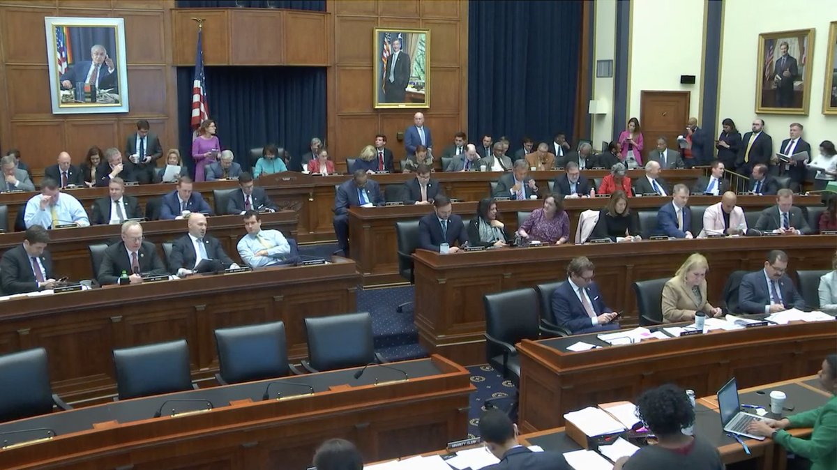 Screenshot of the House Financial Services Committee hearing room shows members in their seats after voting on H.R. 149.