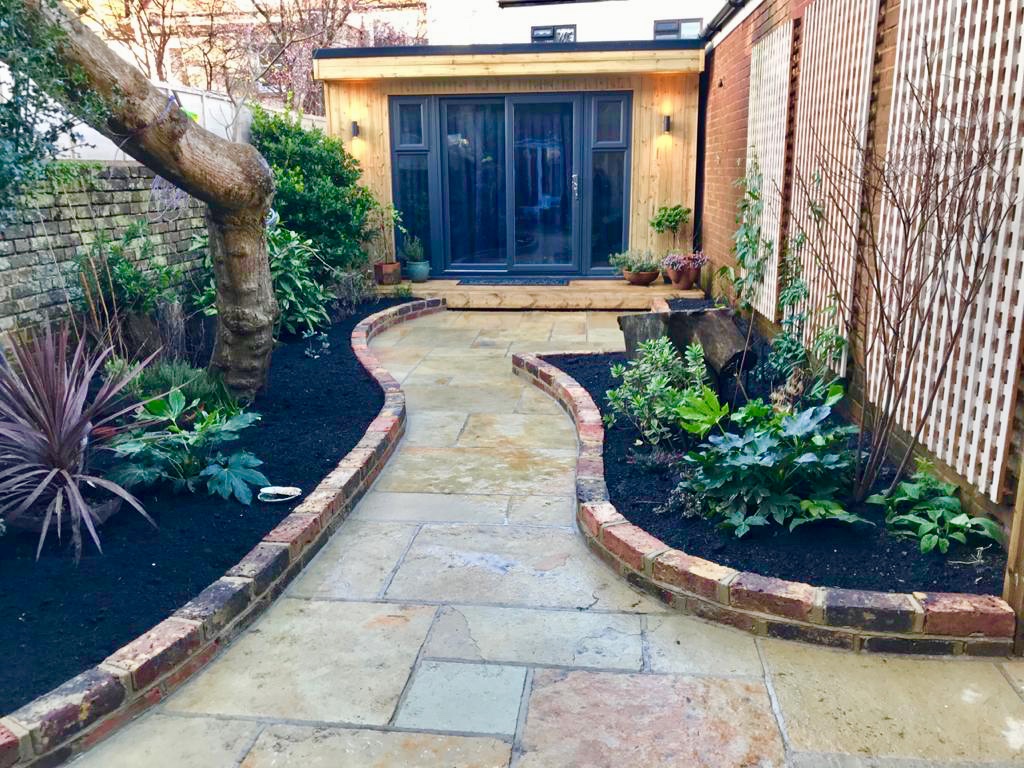 This will give you #gardenroom envy! 😍 The space around our #homestudio build has recently been landscaped, making this corner of the garden an even more desirable place to work as we enter #Spring 🌱 bit.ly/2lWV1PO