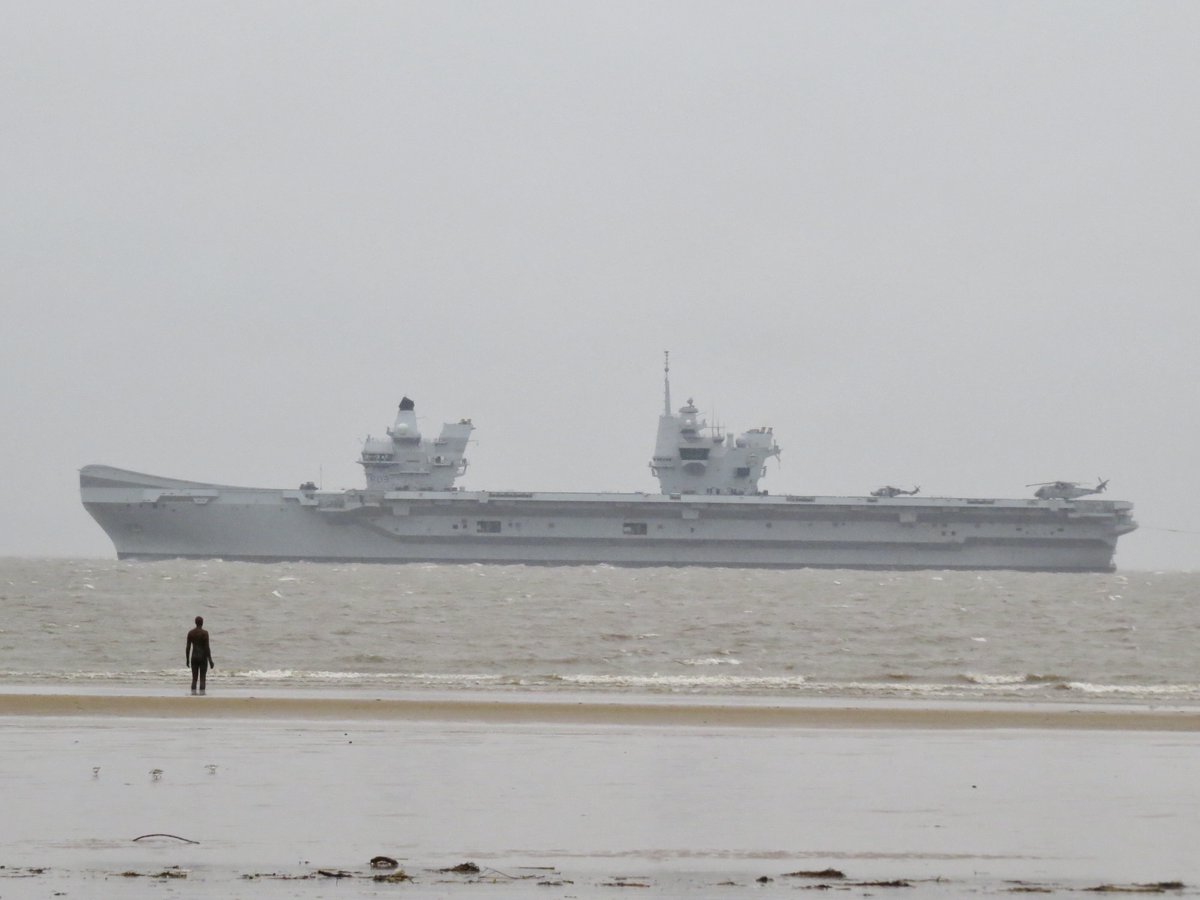 HMS Prince of Wales slipping into a very murky River Mersey at lunchtime today #hmsprinceofwales #CrosbyBeach