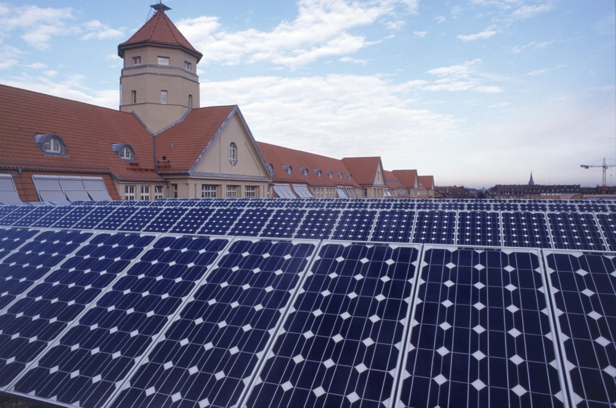 solar panels in the foreground of houses