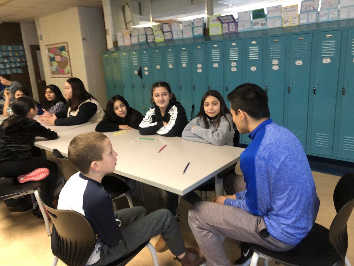 Josue’s group of Nelson students are totally engaged as they discuss how to be an upstander on social media