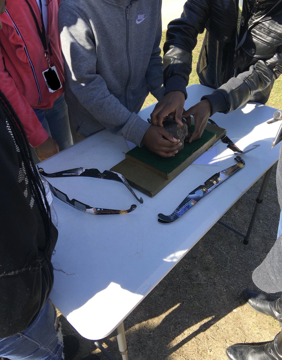 Mr_JamesBaker's tweet photo. Students @IrmoMiddle examine a 4.6 Billion year old meteorite courtesy of Sunspot Larry. https://t.co/IErNXSsY2P