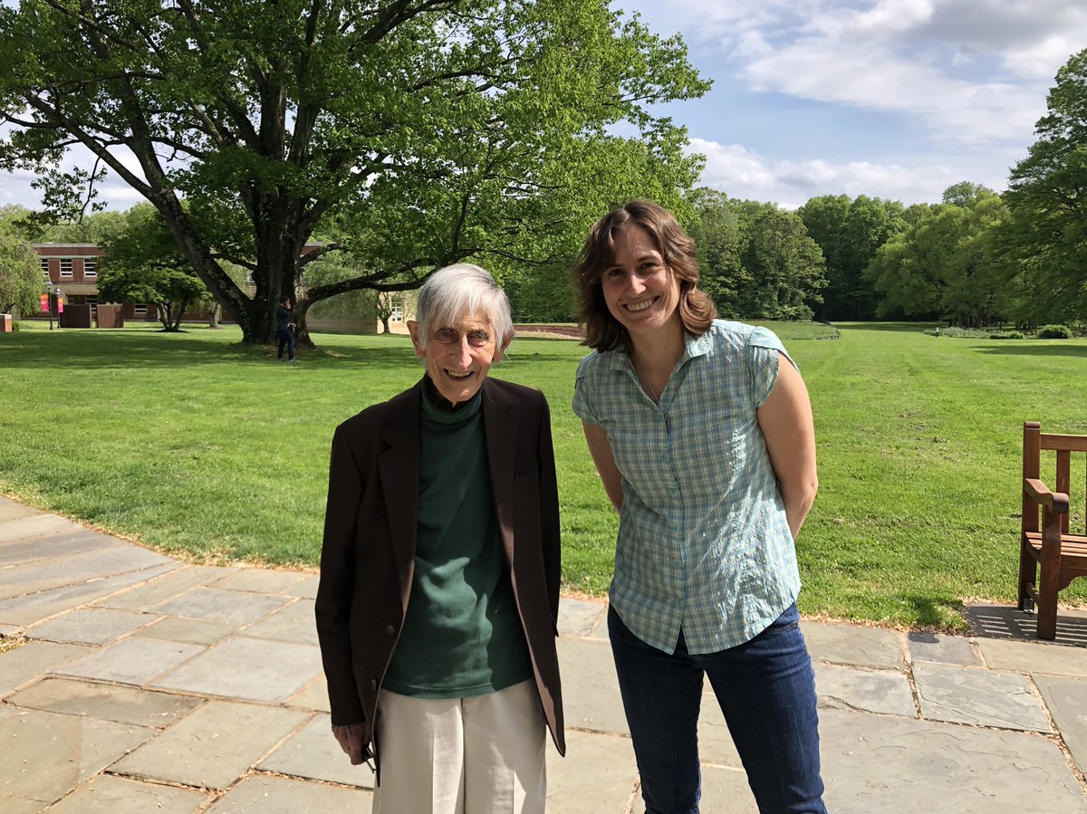 Photo of me standing next to Freeman Dyson on a bright sunny day at the Institute for Advanced Study. He is a bit shorter than me, with white hair and a brown coat. We’re both smiling broadly.
