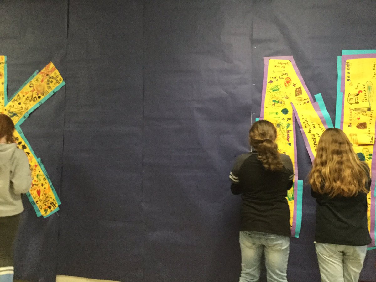 There putting up a KIND sign for a bulletin board #ofesleads #ofeskids