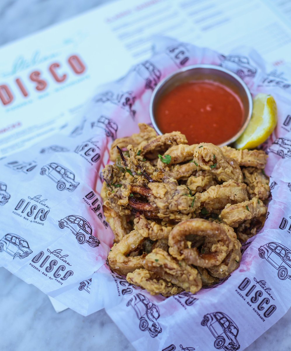Tender &amp; Crispy 🦑 #ItalianDisco Fried Calamari served with a side of Tomato Sauce.
