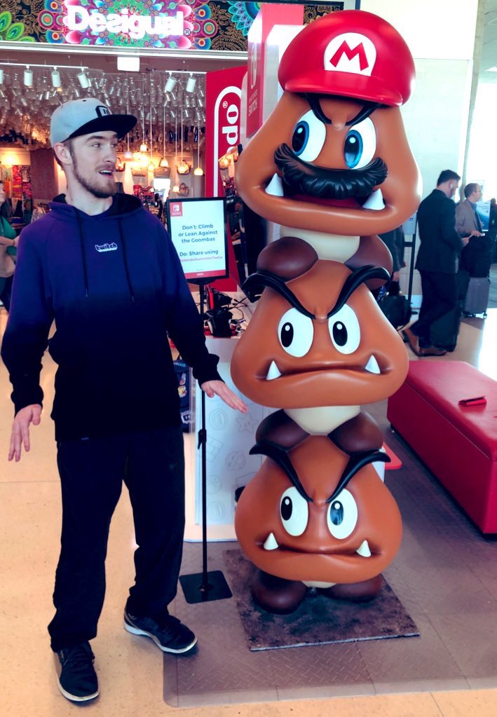 _Smirky's tweet photo. My trip to #PAXEast has begun in the best way possible!
@NintendoAmerica set up a station at Dallas-Love Field! I played a game of Smash and met the goombas! #NintendoSwitchOnTheGo
Now I can’t WAIT to play Animal Crossing in Boston! About to board my flight...let’s have fun! 🤗 https://t.co/SeJ7uSnbYx