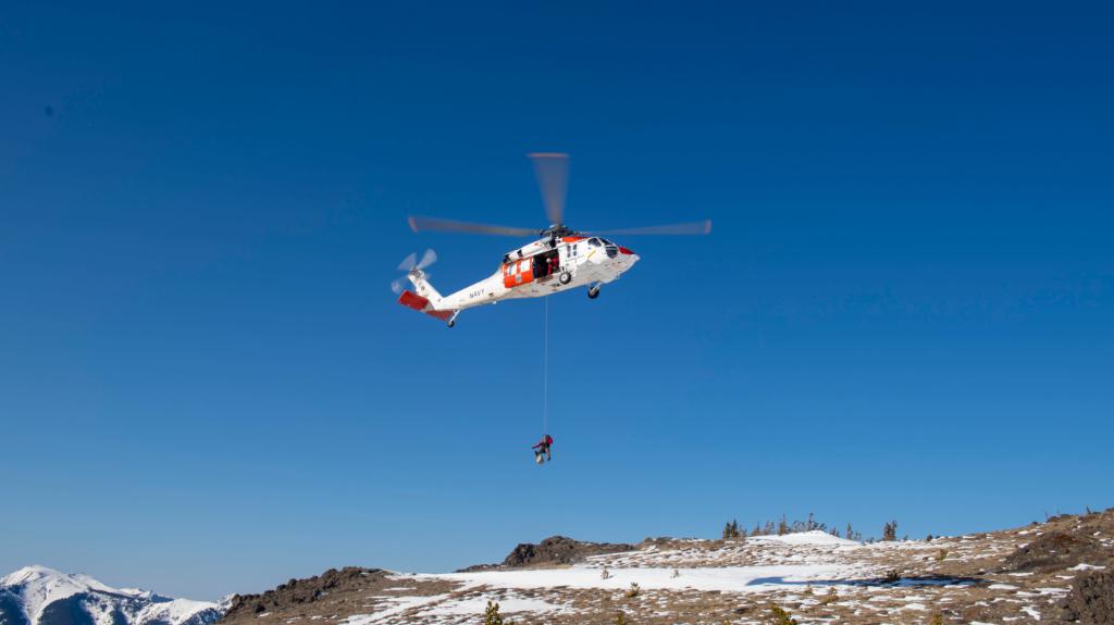 USNavy's tweet photo. We rescue people on land too! 

A #USNavy  MH-60S Sea Hawk helicopter and crew from Naval Air Station Whidbey Island conduct a Search and Rescue Alpine SAR Training mission in the Olympic Mountains in preparation for emergencies that include over water and mountain rescues. https://t.co/skrYOuXOXR
