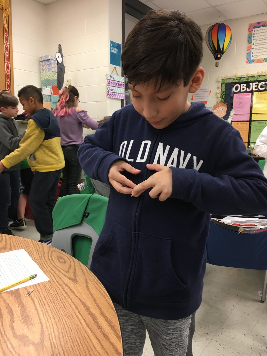 TBranderson's tweet photo. Students try life without opposable thumbs - opening a jar, linking paperclips, and buttoning a lab coat. #SCES20  @SandersCornerES https://t.co/Er9o02VtPC