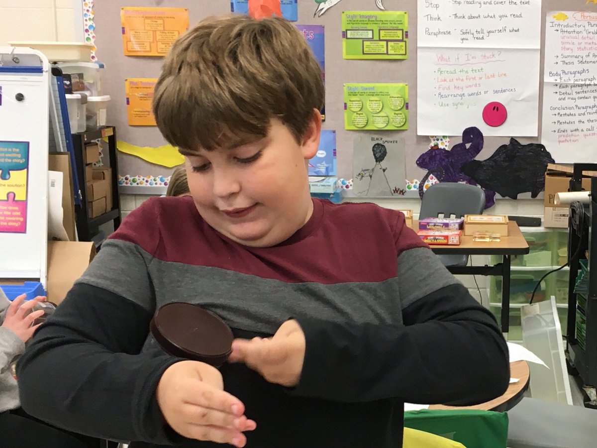 TBranderson's tweet photo. Students try life without opposable thumbs - opening a jar, linking paperclips, and buttoning a lab coat. #SCES20  @SandersCornerES https://t.co/Er9o02VtPC