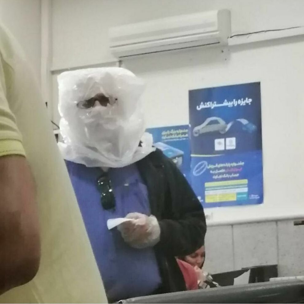 There has been lack cleaning and disinfecting items. You cannot find masks let alone filtered ones. People have resorted to improvisation - this person in bank (for many transactions you still have to go to a branch) trying to protect himself.  #COVID19  #irancoronavirus