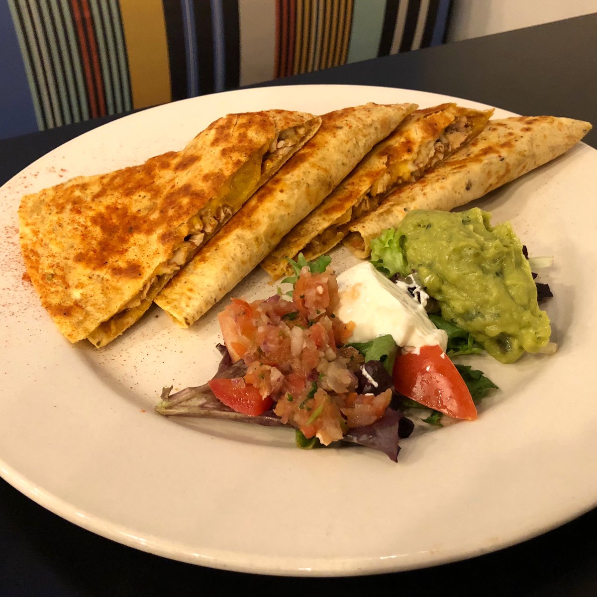 CHICKEN FAJITA QUESADILLA — grilled chicken, peppers, onions, tomatoes, cheddar and pepper jack cheese $10 with side