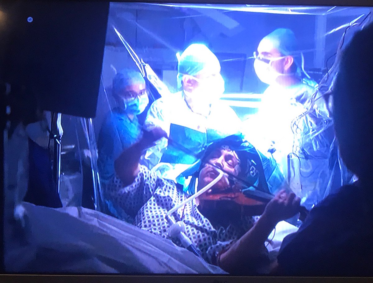 KingsNeuro's tweet photo. King’s Neurosurgery at its best! Awake Craniotomy with Violin player! 

Thank you @itvnews for featuring us in your news tonight. 

#goingbeyond #pushingboundaries

@KingsNeuro @KingsCollegeNHS @The_SBNS 

Pictures courtesy @itvnews https://t.co/1425WFclCr