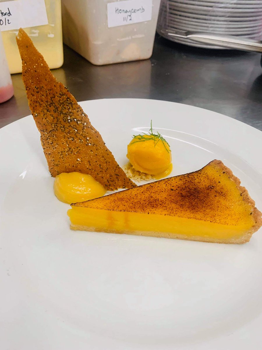 ConnorRance's tweet photo. Passionfruit tart, lemon curd sauce, mango sorbet &amp; a poppy seed tuille #valentinesspecial #chefslife #food #somerset https://t.co/jJVTfla1TJ
