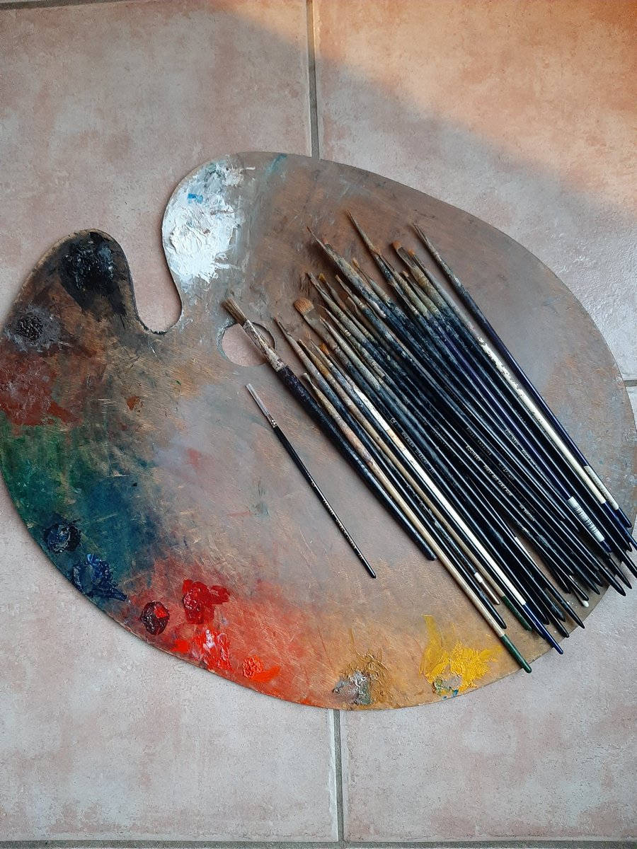 Bernie's palette and a selection of his brushes. He liked to use size 0 brushes for detail. He made his own paints - grinding pigments every morning before starting work. #bernardsafran #painters #oils #artists #palette #artmatters #artisttools #Colors #realist #studio