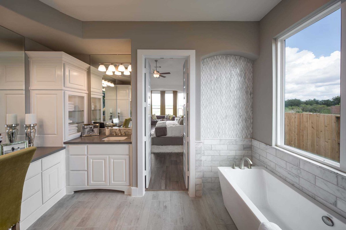 From the built-ins to the stunning detail and design of the space. This luxurious master bathroom has everything you could desire and more. #HighlandHomesTX