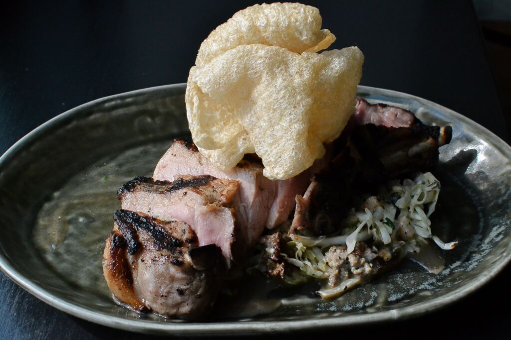 Our Lady Edison pork chop, paired with seasonal ingredients, hits our wood-fire grill before it hits your table.