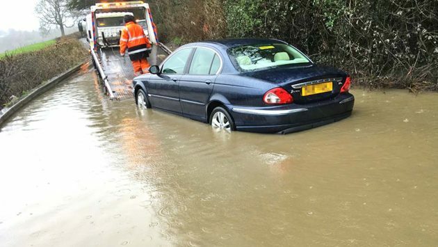 horseandhound's tweet photo. Stand back, boys: rider and trusty wellies to the rescue as Jaguar stuck in flood https://t.co/rOvO9URSq2 https://t.co/KFbCMXmH00