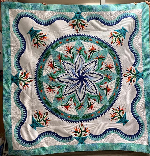 kathleenquilts's tweet photo. I FINALLY FINISHED THIS QUILT!! I’ve only been working on it for three months... that and the fact that I’m feeling better after yesterday’s cold... time to start packing for QuiltCon. #fmq #longarmquilting #pradiseinbloom #quiltworx #apqs #apqslucey https://t.co/ivsfCKuNYu https://t.co/zhz4DZLEQE
