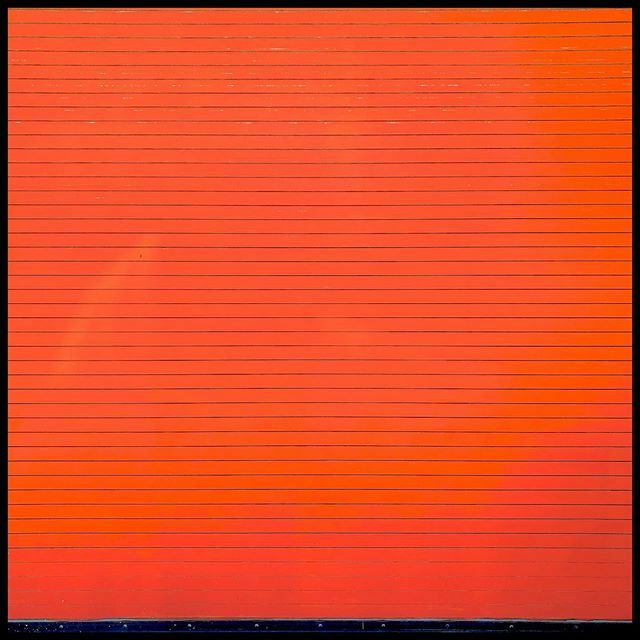 davidtruog's tweet photo. Oversized steel curtain roll-up door, thinking of Agnes Martin https://t.co/6fGBZVc7Cz
