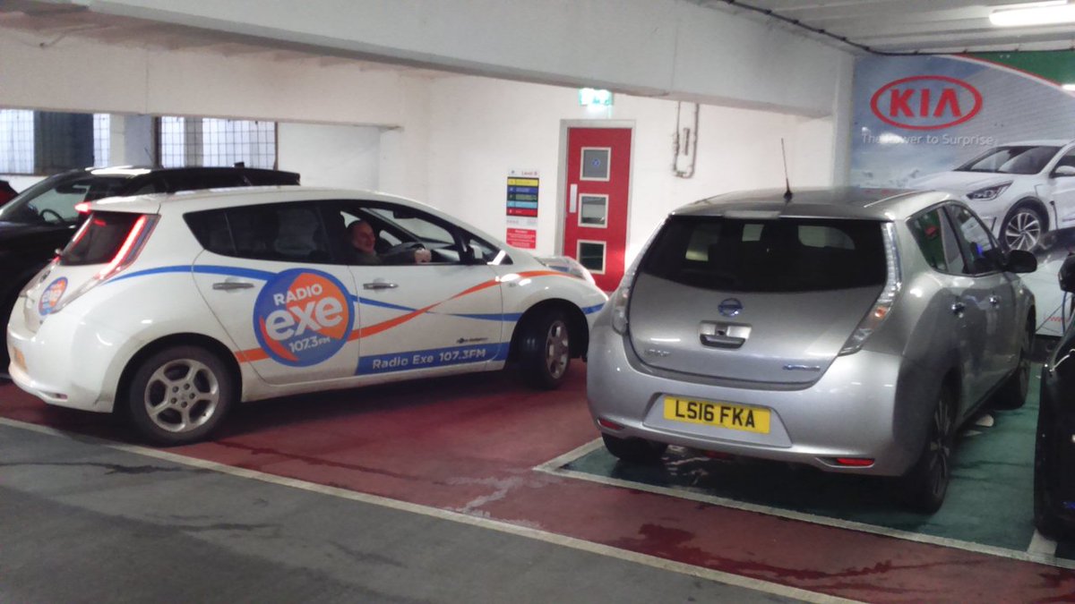 jim_hunt's tweet photo. @We_Are_Liminal @VMHatfield @CllrSutton @Pod_Point @Tesla @BPChargemaster @polarnetwork @ncpcarparks @ExeterCouncil @liz_odriscoll @OVOEnergy With Lisa finally on charge I rushed off to #NetZeroExeter, but my tale is far from over. On returning to Lisa I emerged from the stairwell just in time to flag down Adrian from @radioexe to inform him (and Laurie the #LEAF) that our bay would soon be free:
13/n https://t.co/w6ZHQg1y4B