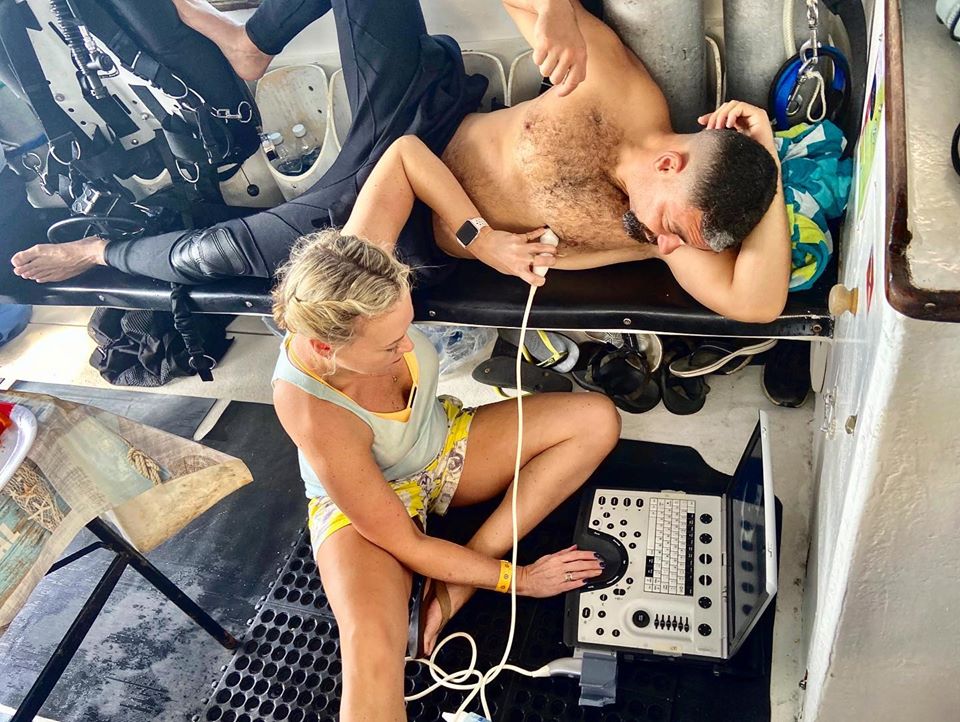 DANGlobalSafety's tweet photo. Another successful #TechWeek in the books at Deep Exposure Dive Center in Cozumel. Check out the #DANResearch team doing their thing, looking for venous gas bubbles in divers after their deep, long #TechnicalDives and presenting on cardiac issues & diving. https://t.co/z7VZRFuHme